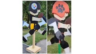 Picture of two football player whirligig lawn ornaments, one decorated with Pittsburgh Steelers attire, one in Wellsville Tigers attire. 