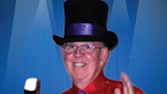 headshot of Tom Phoolery wearing a top hat